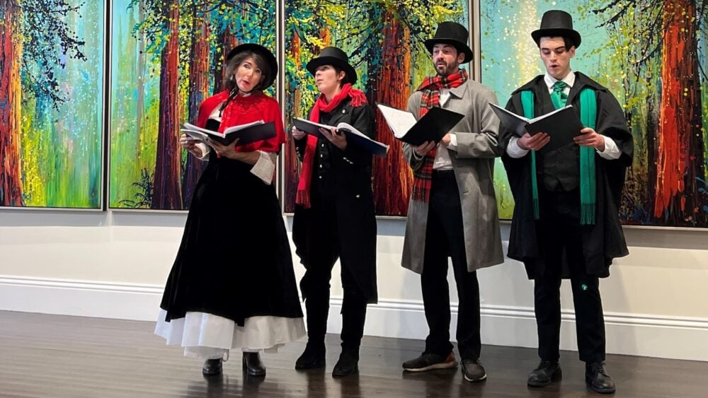 Christmas carolers in dickens costume